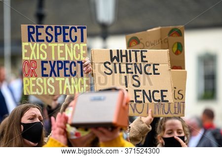 Richmond, North Yorkshire, Uk - June 14, 2020: Anti Racism Signs Held High By Ppe Face Mask Wearing 