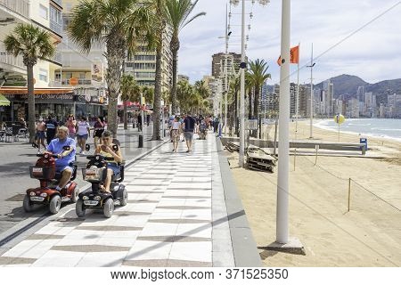 Benidorm, Spain, 14 June, 2020: People Enjoy Sunny Day In Benidorm Levante Beach Promenade. Popular 
