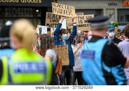Richmond, North Yorkshire, Uk - June 14, 2020: Protesters Wear Ppe Face Masks And Hold Homemade Blac