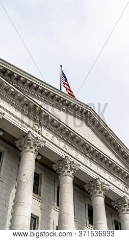 Vertical Crop Pedimented Entrance Of Historic Utah State Capital Building In Salt Lake City