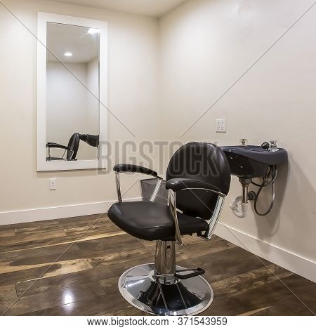 Square Frame Hairdresser Chair And Backwash Shampoo Bowl Inside Salon With Bench And Mirror