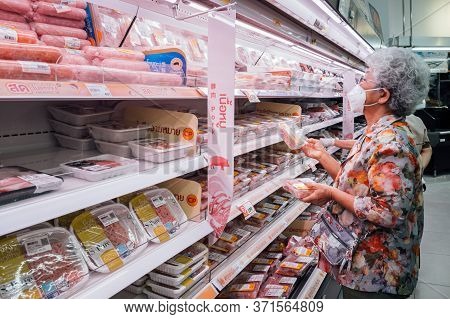 Bangkok, Thailand - June 15, 2020 : Asian Senior Old Woman Wearing Hygiene Face Mask Choosing And Sh