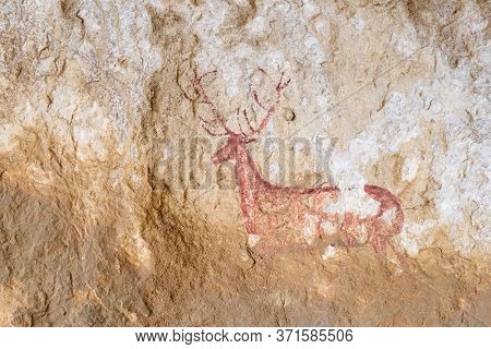 Rock painting of a deer in the Chimiachas ravine, Guara Mountains, Huesca province, Aragon in Spain.