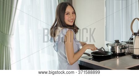 Asian Woman Happu Cooking At Home Indoor Kitchen