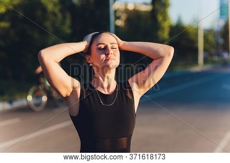Tired Runner Sweating After Running Hard In Countryside Road. Exhausted Sweaty Woman After Marathon 