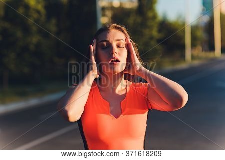 Tired Runner Sweating After Running Hard In Countryside Road. Exhausted Sweaty Woman After Marathon 