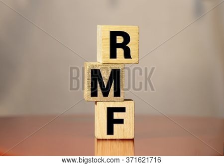 Wood Block Word Rmf And Coins With Copy Space Using As Background Business Financial, Saving Money, 