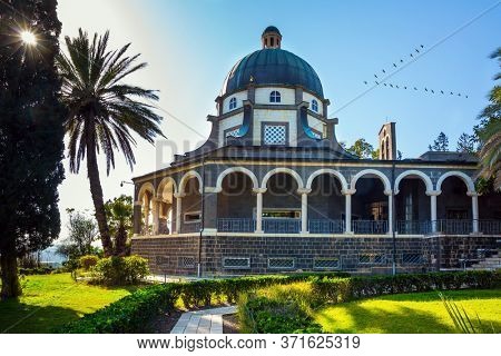 Catholic Church of the Beatitudes of the Franciscan monastery. The Mount Bliss on the Sea of Galilee. Blooming huge park around the monastery. Israel. The concept of religious pilgrimage 