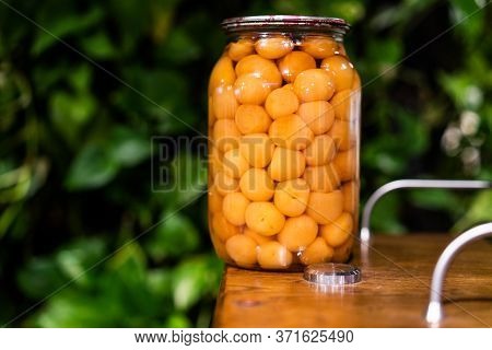 Jar Of Cherry Plum Compote Close View