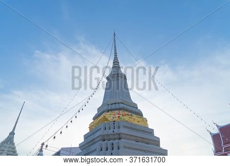 Wat Chantharam Worawihan Or Wat Klang Talat Phlu, A Buddhist Temple Stupa At Noon With Blue Sky In B