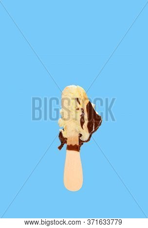 Chocolate Outer Popsicle With The Last Bit On Blue Background