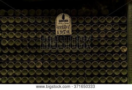 Porto, Portugal - May 31, 2018: Dusty Bottles Of Rare Vintage Port Wine Stored At Sandeman Cellar, P