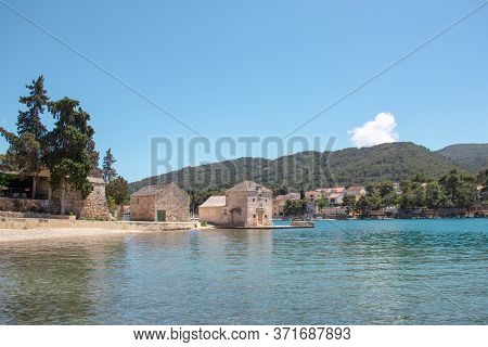 Small Picturesque House Of Saint Jerolim, Stone Greek Style Building Standing On The Waterfront Of S