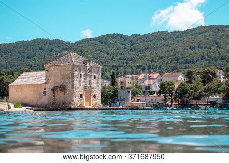 Small Picturesque House Of Saint Jerolim, Stone Greek Style Building Standing On The Waterfront Of S