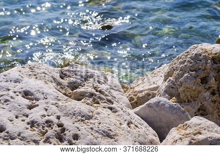 Turquoise Shallow Water Surface And Rocks Stones On Sea Floor. Shallow Transparent Green Sea Water R