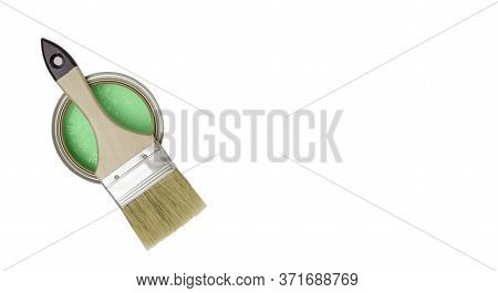 Paint Brush With A Wooden Handle On A Can Of Green Paint, Top View. White Background, Free Space For