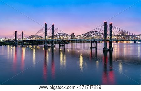 The Abraham Lincoln Bridge And The John F. Kennedy Memorial Bridge Across The Ohio River Between Lou
