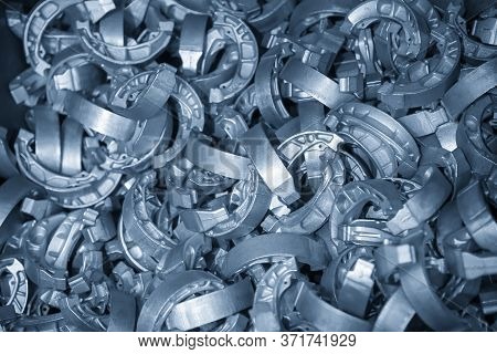 The Pile Of Aluminium Casting Parts Of Drum Brake. The Automotive Parts Manufacturing Process By Die