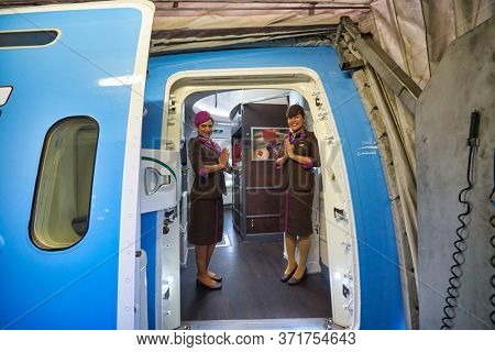 BANGKOK, THAILAND - CIRCA JANUARY, 2020: crew members of Etihad Airways meet passengers. Etihad Airways is the flag carrier of the UAE.