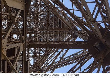 Inner Up View Of The Eiffel Tower Structure Against A Pur Blue Sky, Paris, France