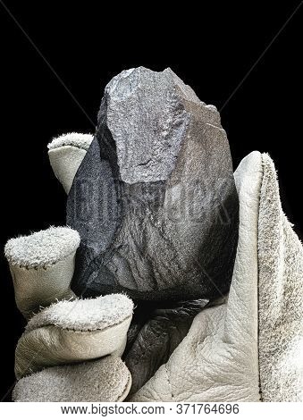 Miner Hand Holding Iron Stone, Metallic Iron Pyrite, Steel, Used In Heavy Industrial Production. Min