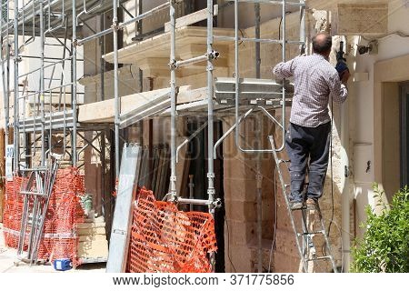 Polignano A Mare, Italy - May 29, 2017: House Renovation Worker Works In Polignano A Mare Old Town I