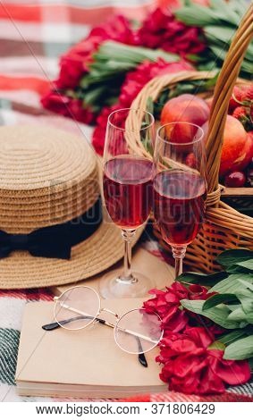 Mood Reading A Picnic Book Under A Glass Of Red Wine