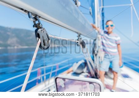 Little Boy On Board Of Sailing Yacht On Summer Cruise. Travel Adventure, Yachting With Child On Fami