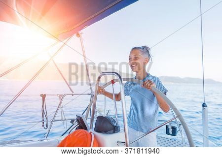 Little Boy On Board Of Sailing Yacht On Summer Cruise. Travel Adventure, Yachting With Child On Fami