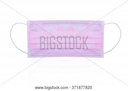 Pink Surgical Or Medical Face Mask Isolated On White Background. Surgical Face Mask For Coronavirus 