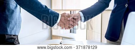 Finishing Up A Meeting, Business Handshake After Discussing Good Deal Of Investment To Sign Agreemen
