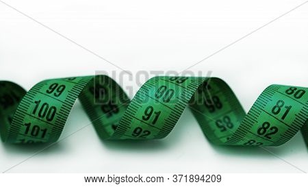 Tape Measure On Plate Remind You Of Proper Nutrition And A Beautiful Figure.