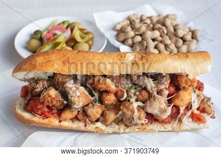Chicken With Cheese Tomato And Spices Olives Pepper And Peanuts On A Plate