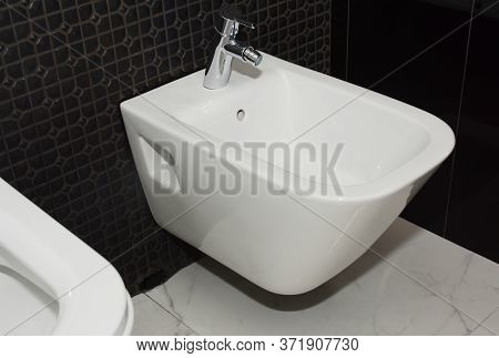 A Close Up On Ceramic One Piece Wall Hung Women Clean, Feminine Hygiene  Bidet Toilet Installed On A