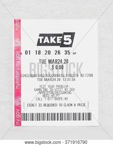 Babylon, New York, 11 April 2020: Losing Take 5 Lottery Ticket From March 24 2020 With A White Backg