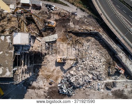 Aerial View Of Building House Demolition And Construction Site Excavator With Hydraulic Crasher Mach