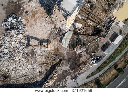 Aerial View Of Building House Demolition And Construction Site Excavator With Hydraulic Crasher Mach
