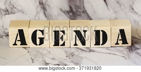 Agenda - Words From Wooden Blocks With Letters, A List Of Matters Agenda Concept, White Background