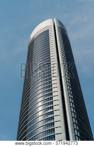 Madrid, Spain - June 14, 2020: Low Angle View Of Skyscraper Against Sky. Pwc Tower In Four Torres Bu