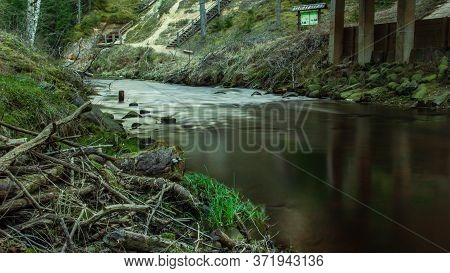 Village Under Bridge View To Dark River