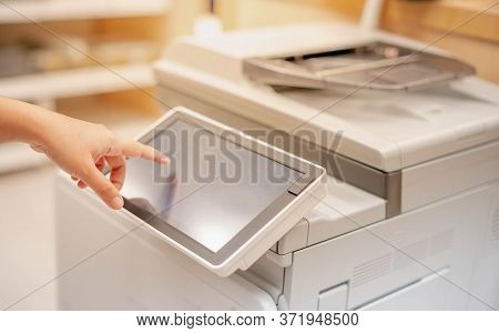Female Hand Pressing The Touchscreen Monitor Of The Copy Machine For Copy A Paper Document, Scanner 