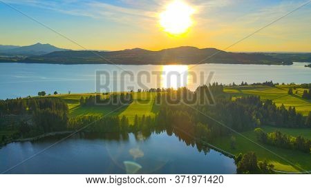 Aerial View Over Lake Forggensee At The City Of Fuessen In Bavaria Germany