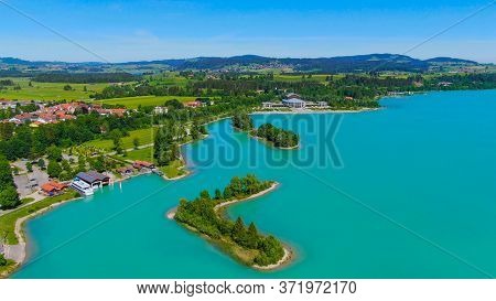 Aerial View Over Lake Forggensee At The City Of Fuessen In Bavaria Germany