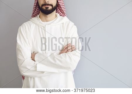 Confident Arabic Man Faceless Crossed His Arms On A Gray Background