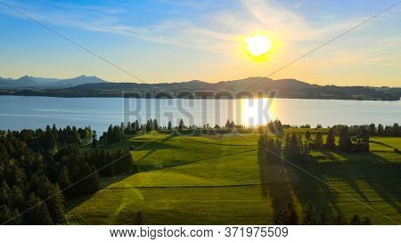 Aerial View Over Lake Forggensee At The City Of Fuessen In Bavaria Germany