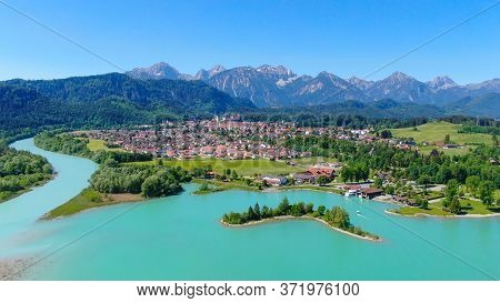 Aerial View Over Lake Forggensee At The City Of Fuessen In Bavaria Germany