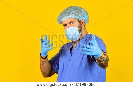 New Viruses Detected All The Time. Beginning Of Virus Outbreak. Man Doctor Uniform Yellow Background