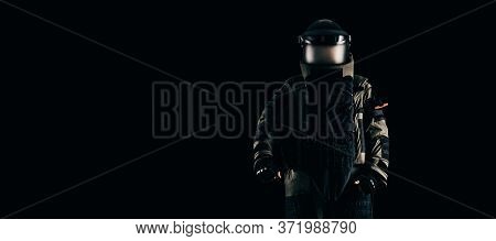 Minesweeper In An Armored Suit. The Concept Of Anti-terrorism. Black Background. Mixed Media