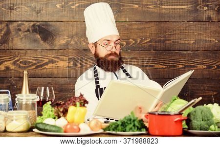 Checking Shopping List. Vitamin. Man Use Kitchenware. Dieting With Organic Food. Fresh Vegetables. C