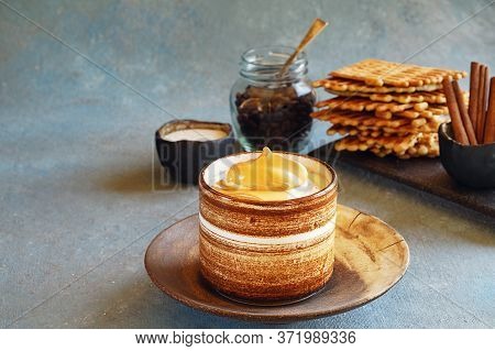 Dalgon Coffee In A Ceramic Cup, On A Plate And Ingredients: Sugar, Coffee. A Saucer With Cinnamon St
